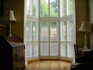 interior shutters in large window in atrium