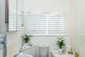 example-of-faux-wood-window-shutters-in-bathroom