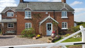 Shutters in North Wales fitted in the window of a cottage