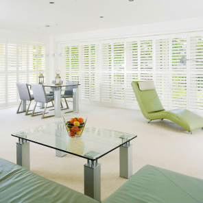 modern living room with full wall window shutters