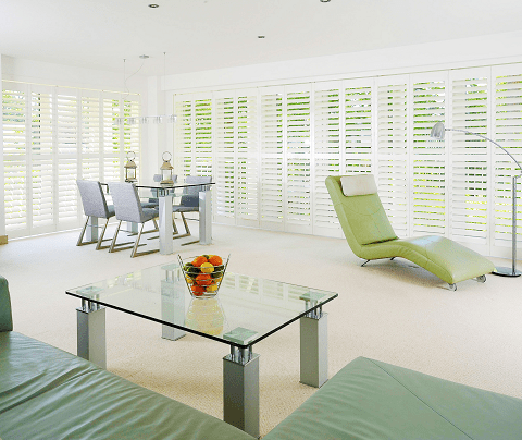 modern living room with full wall window shutters