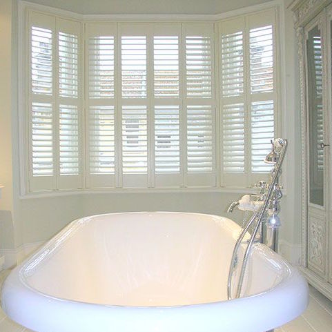White shutters on display in a bathroom